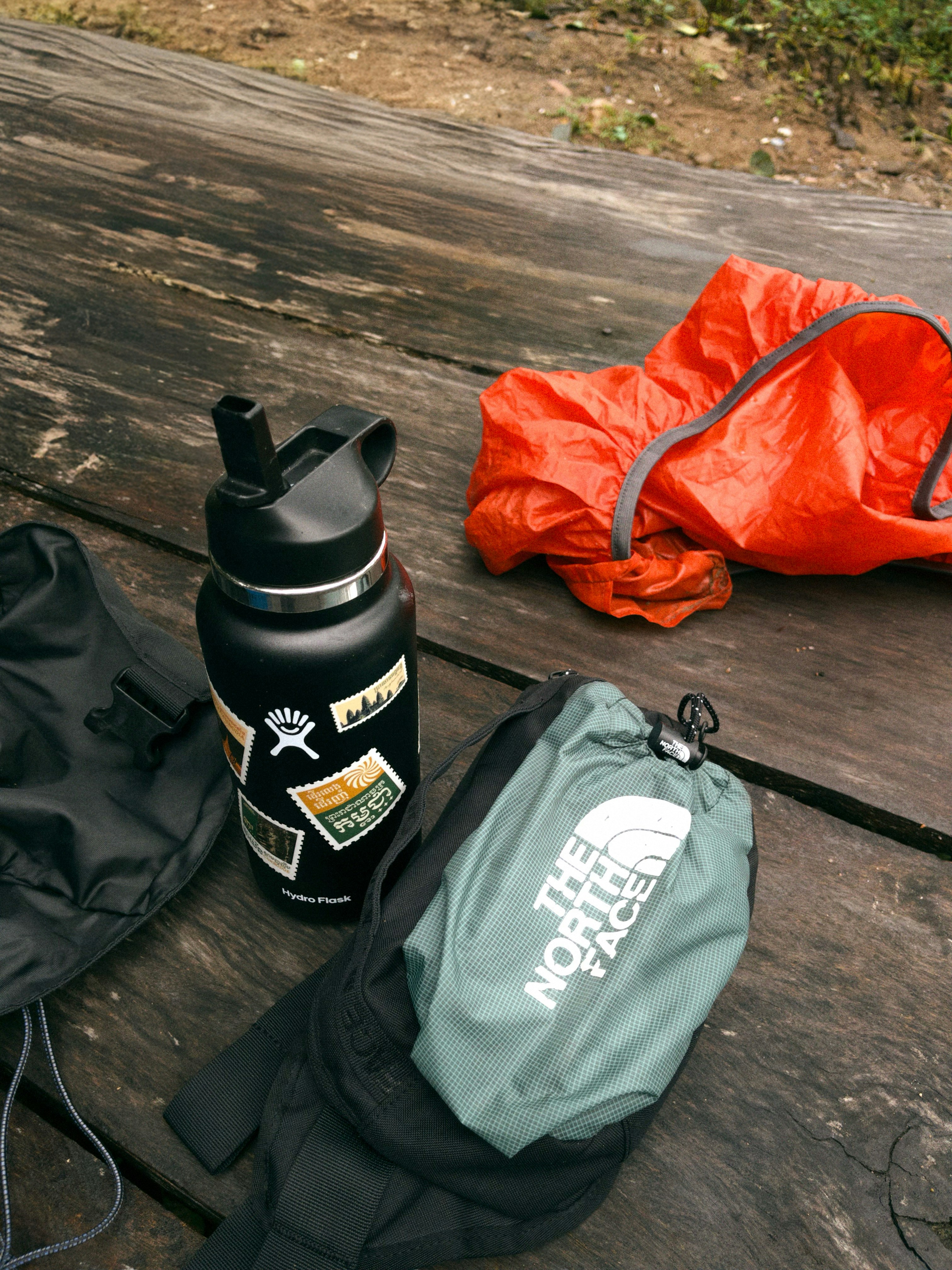 Mountain first aid kit, Hiker resting on trail, Pine forest landscape, Wilderness emergency gear, ilustrasi artikel Essential Wilderness First Aid: A Beginner’s Guide for Outdoor Enthusiasts 3