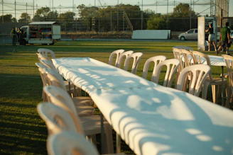 Long table and chairs set up outdoors