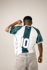 Man wearing a retro soccer jersey with number 10.