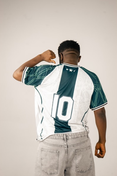 Man wearing a retro soccer jersey with number 10.