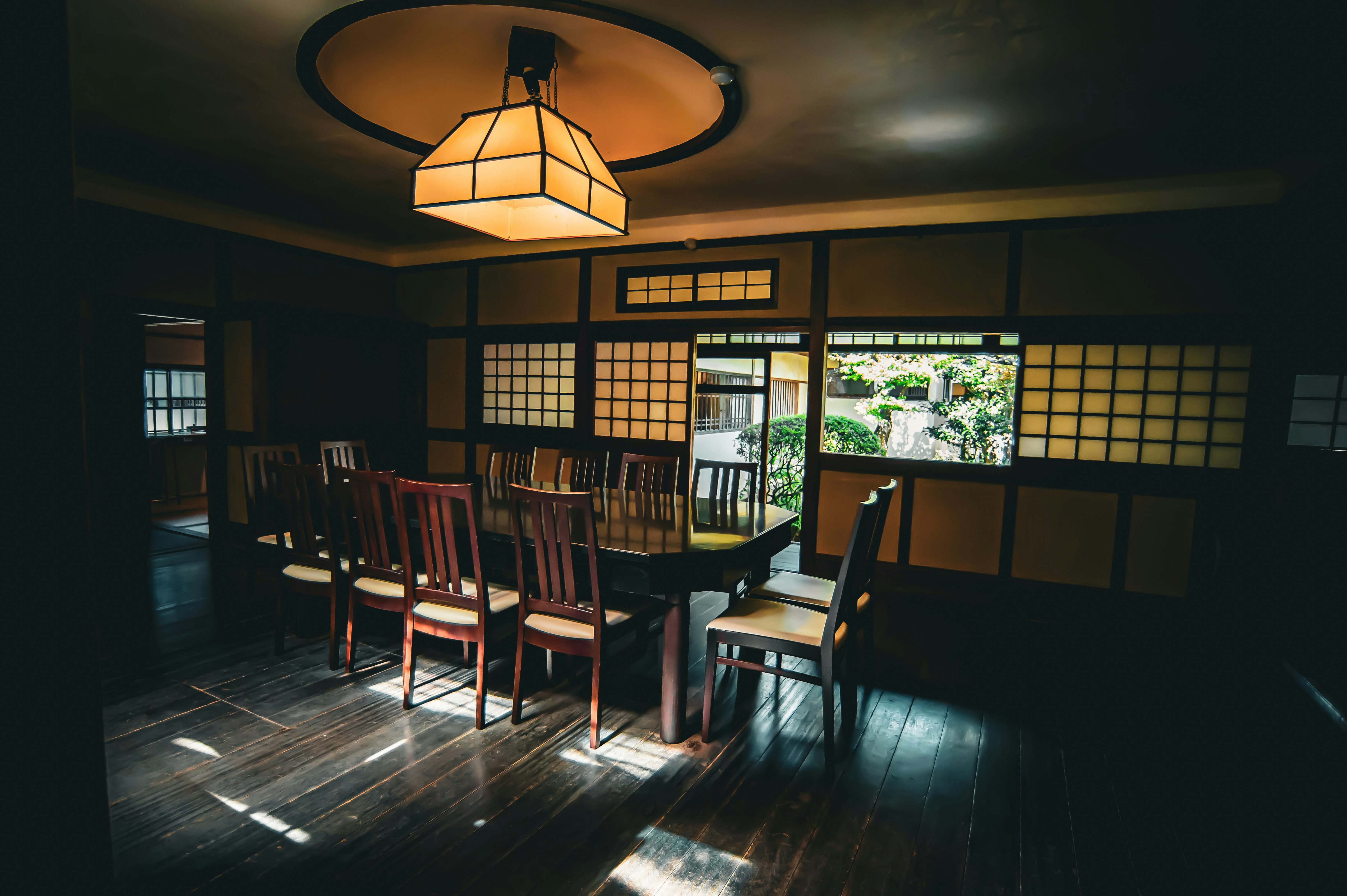 Interior of a brightly lit Japanese family restaurant with people dining