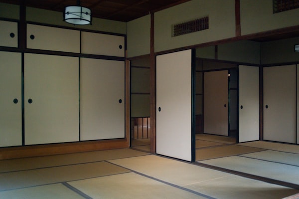 Traditional japanese room with tatami mats and shoji screens.
