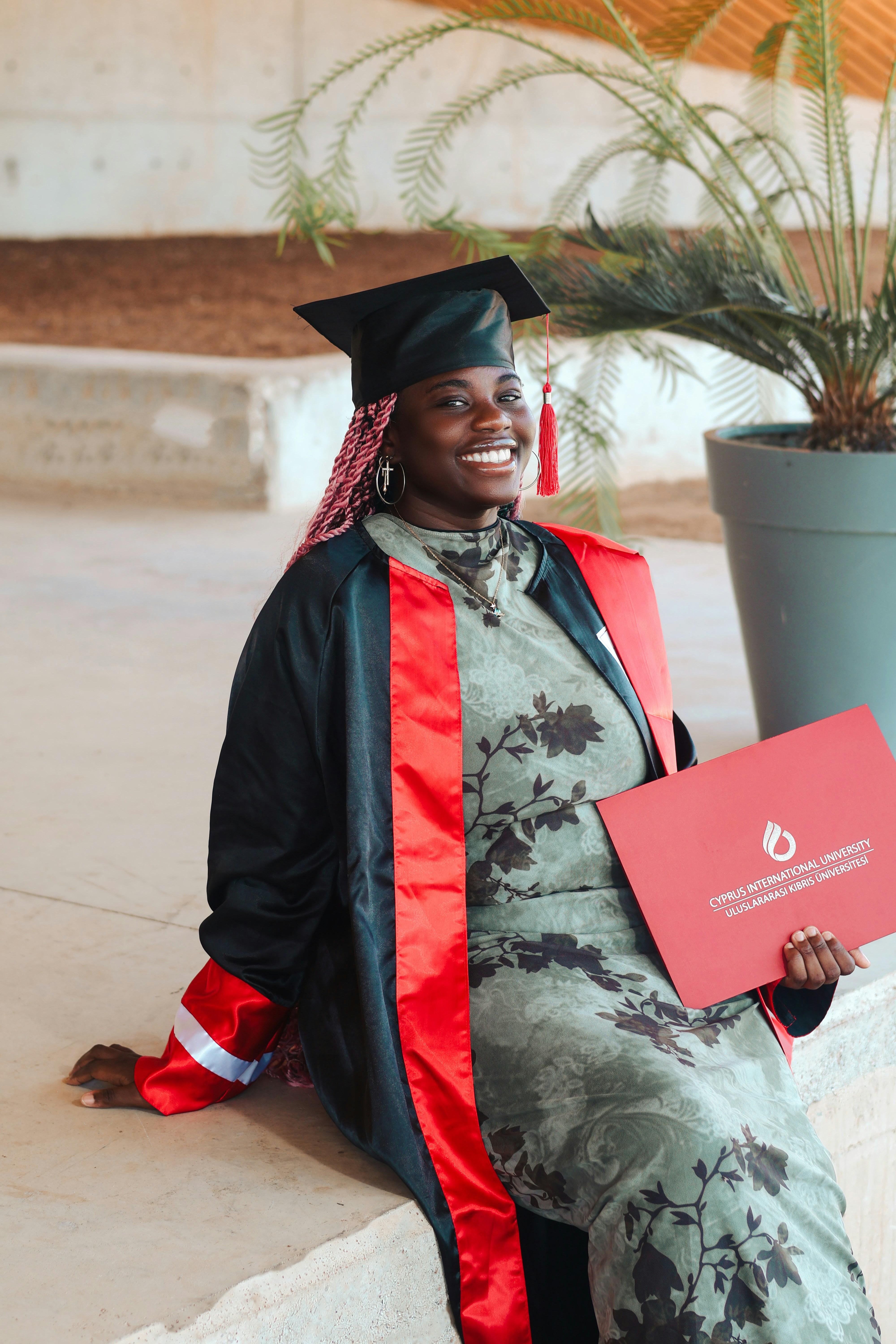 Happy graduate in cap and gown