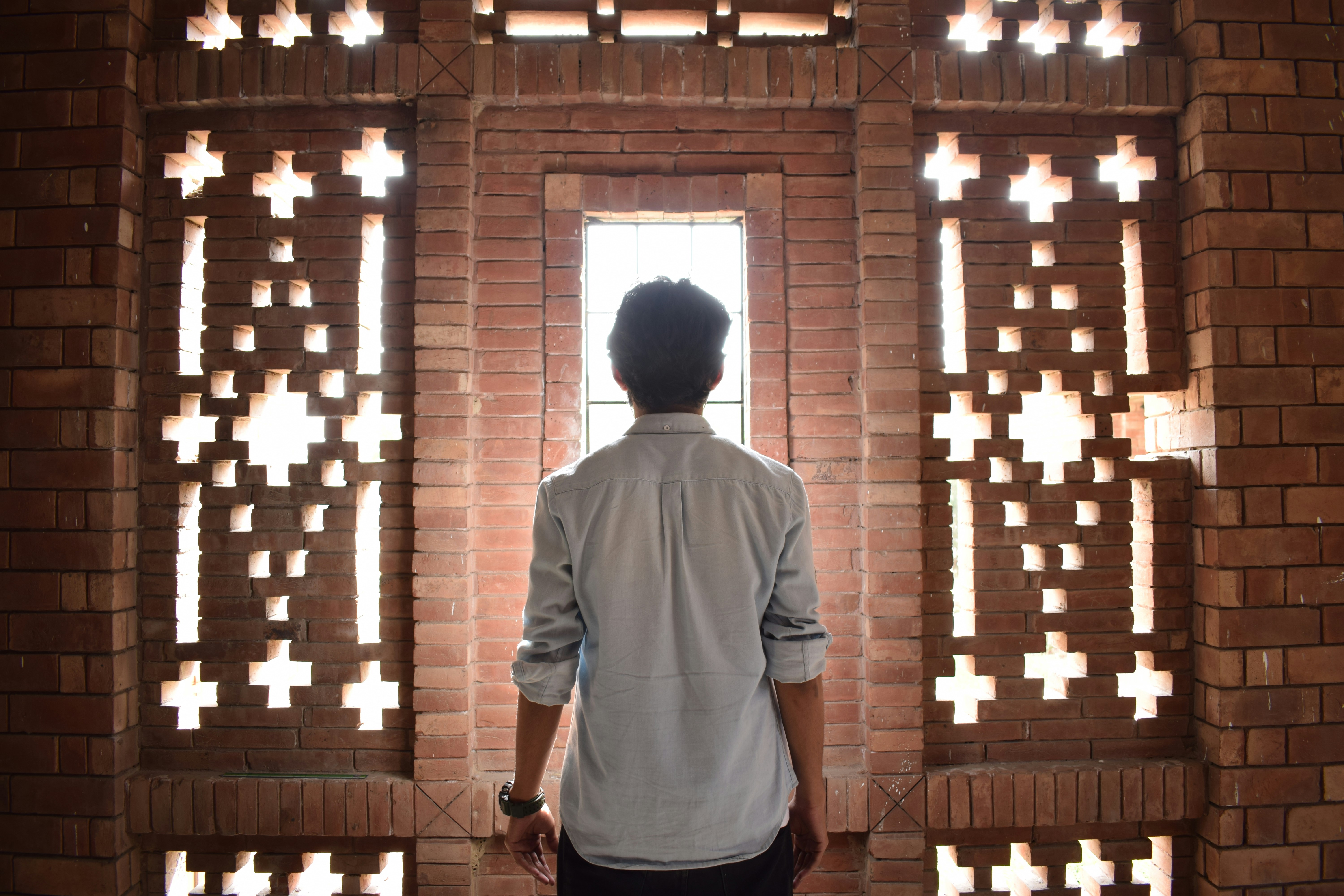 Man standing in front of a window