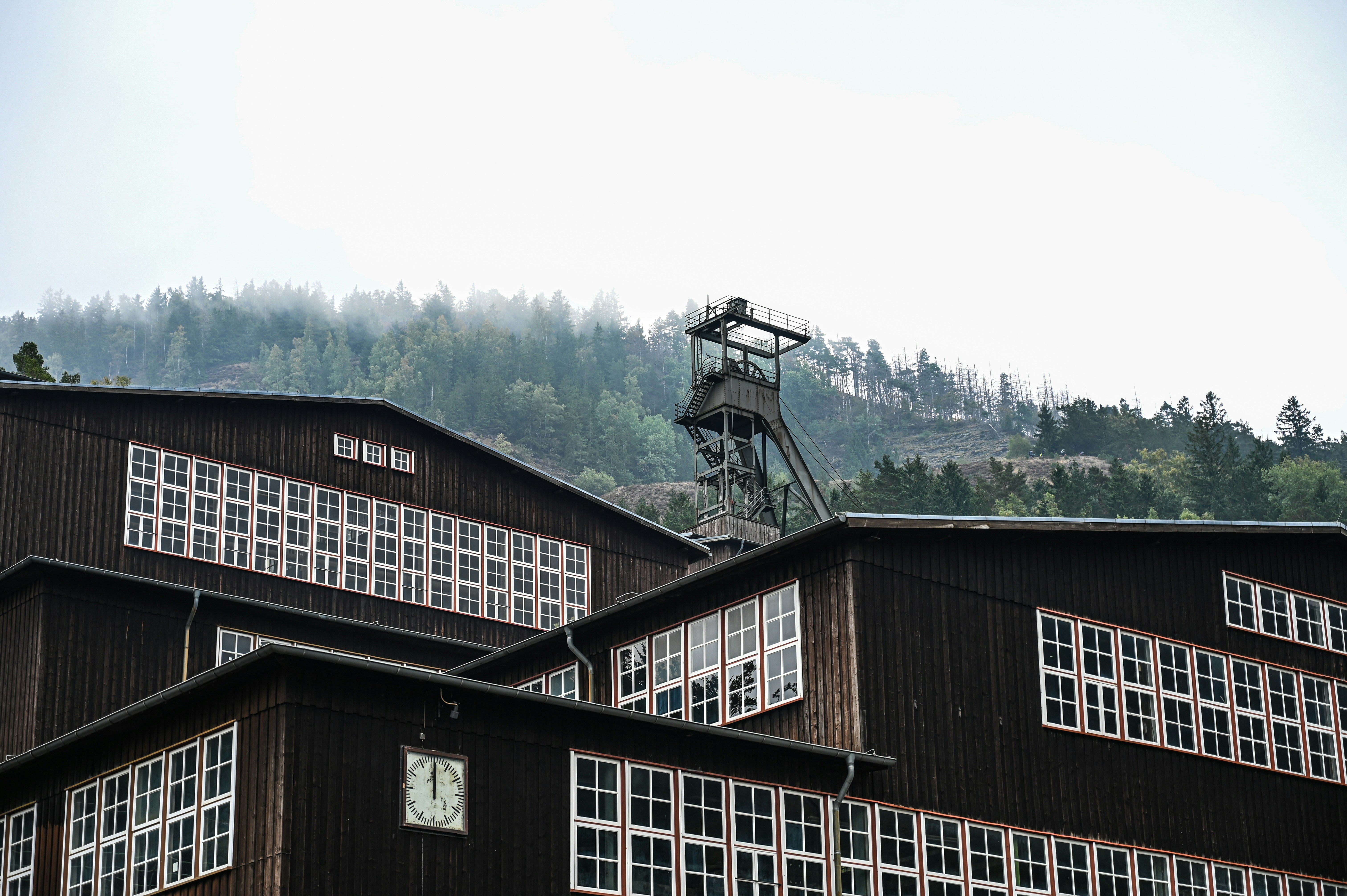 Old industrial buildings with a mine shaft tower.