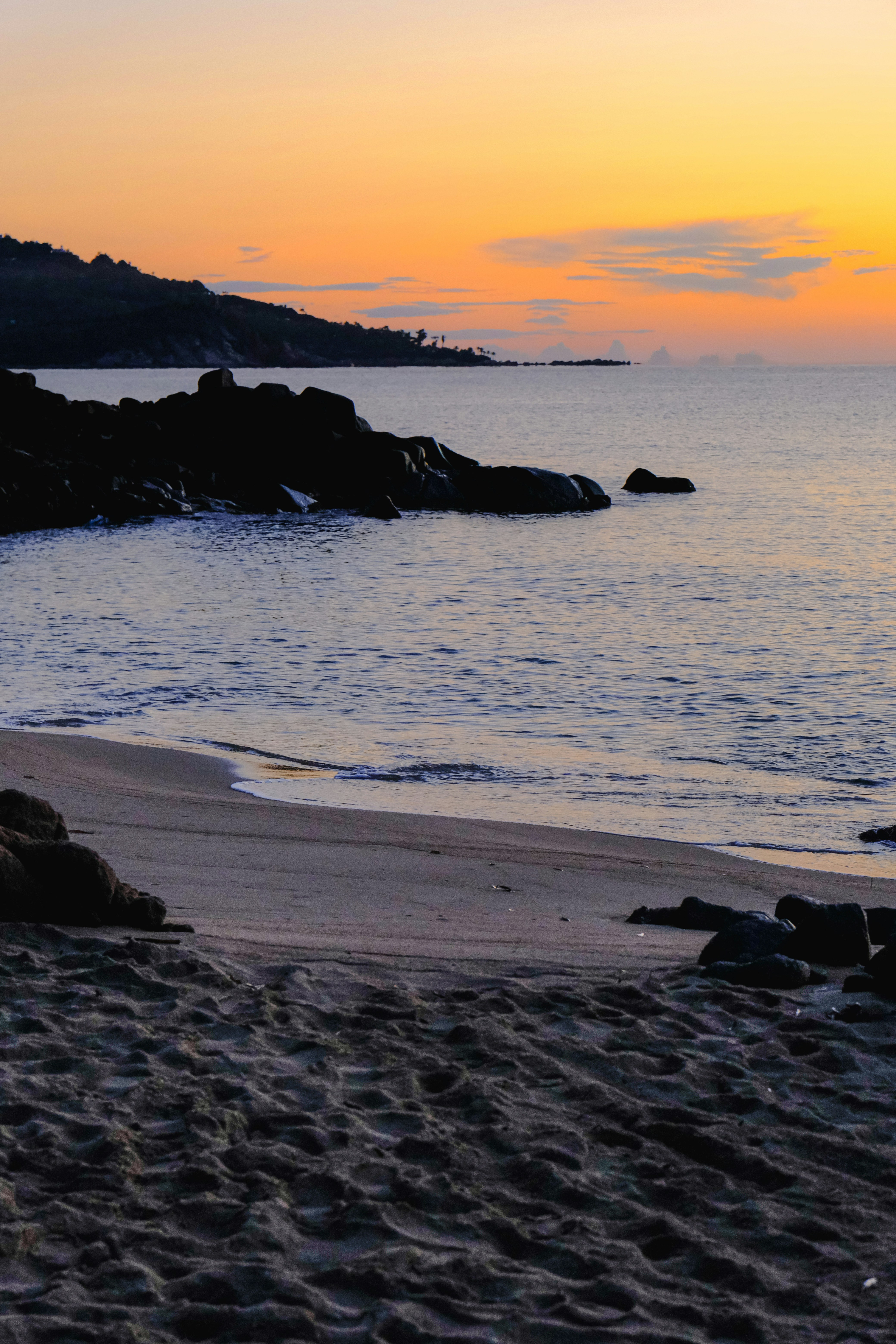 Sunrise over a rocky ocean coastline