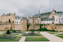 Historic walled city with formal gardens and church