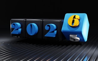 The numbers 2025 and 2026 on rotating cubes