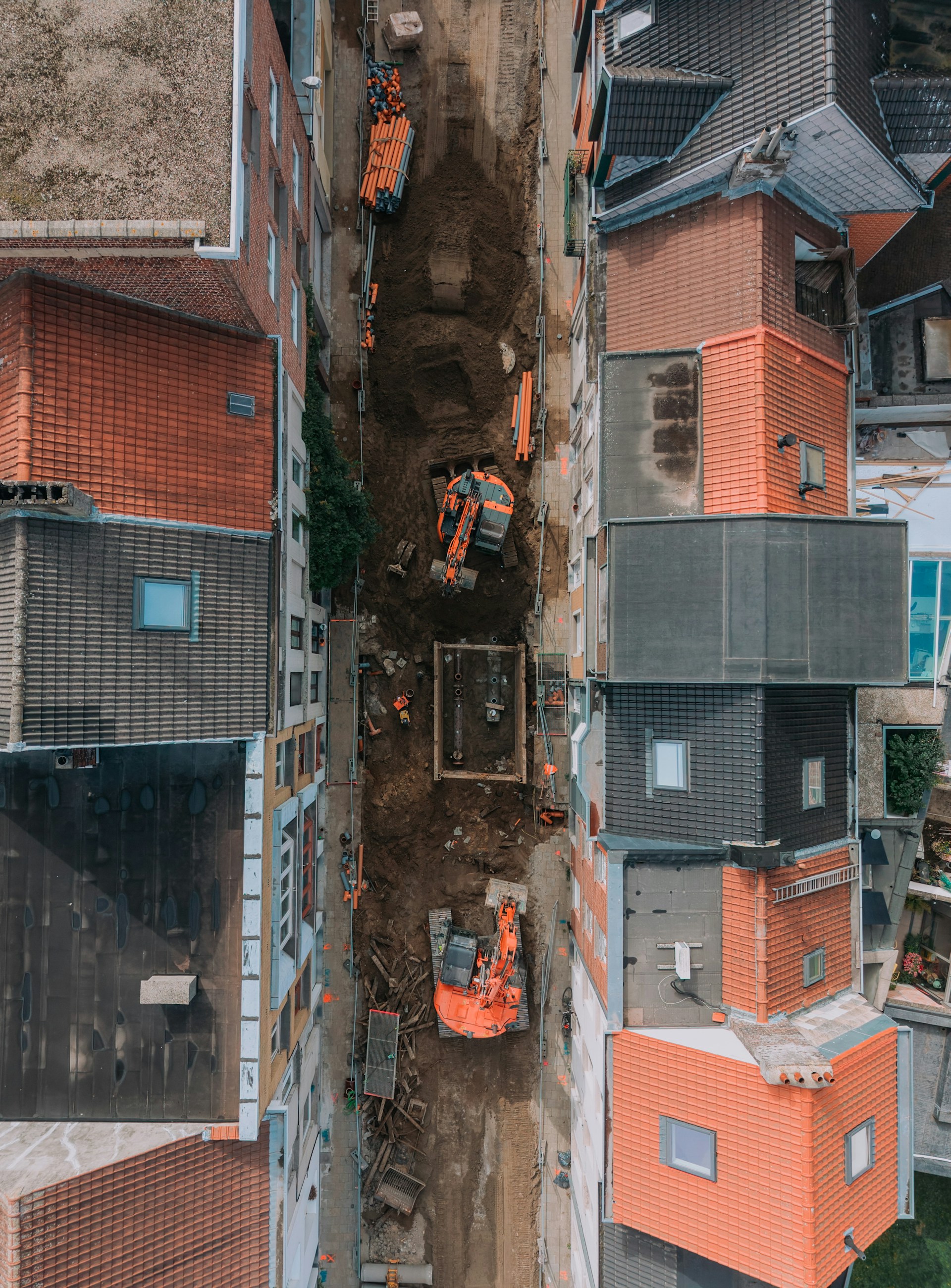 Aerial view of construction site between buildings