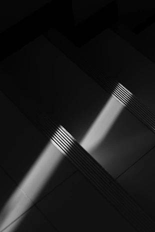 Staircase with dramatic light and shadow patterns