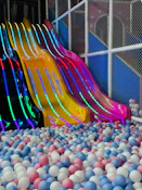 Colorful slides over a ball pit