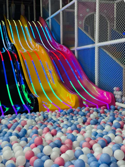 Colorful slides over a ball pit