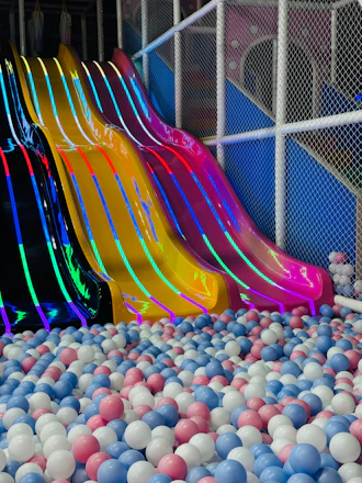 Colorful slides over a ball pit
