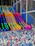 Colorful slides over a ball pit