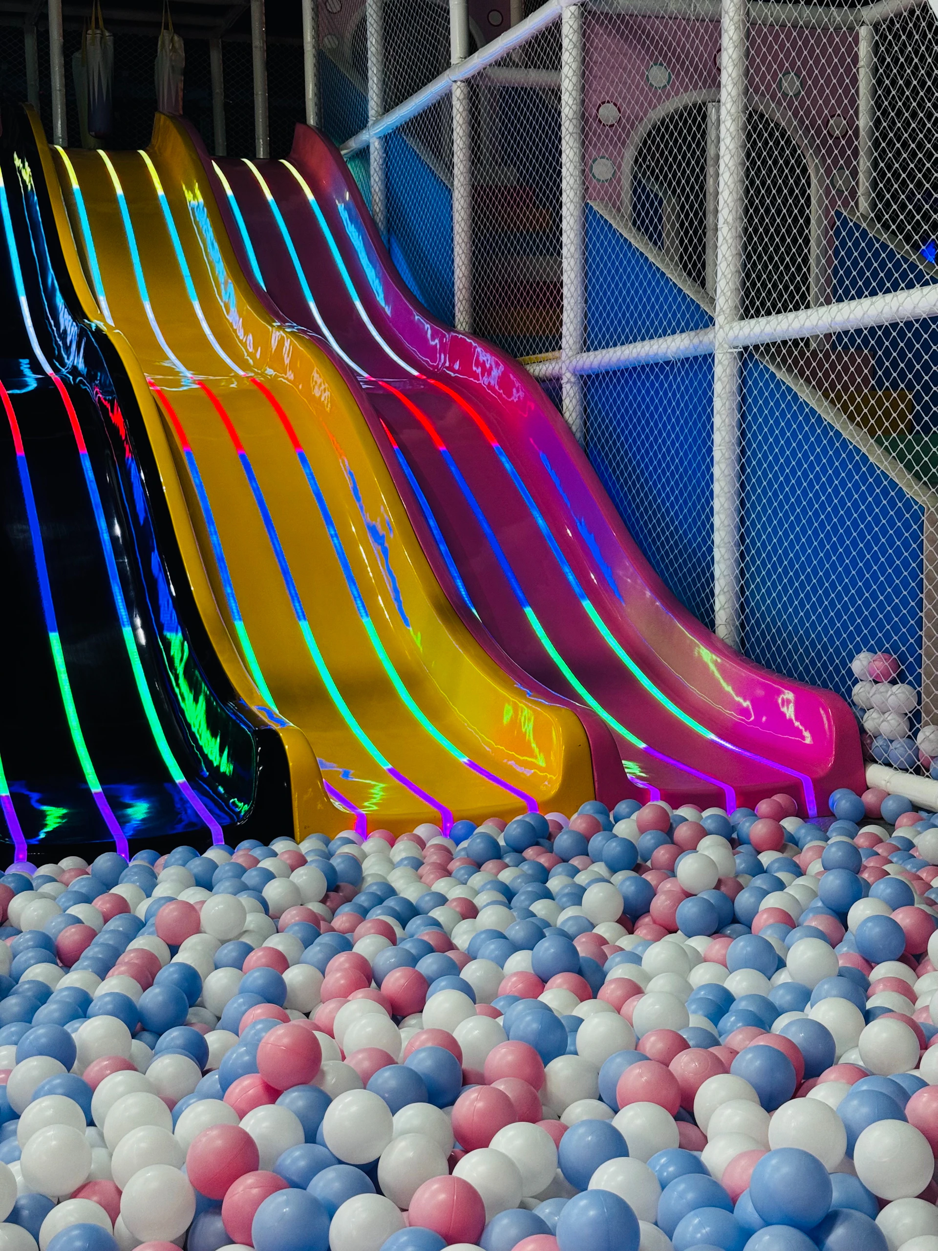 Colorful slides over a ball pit