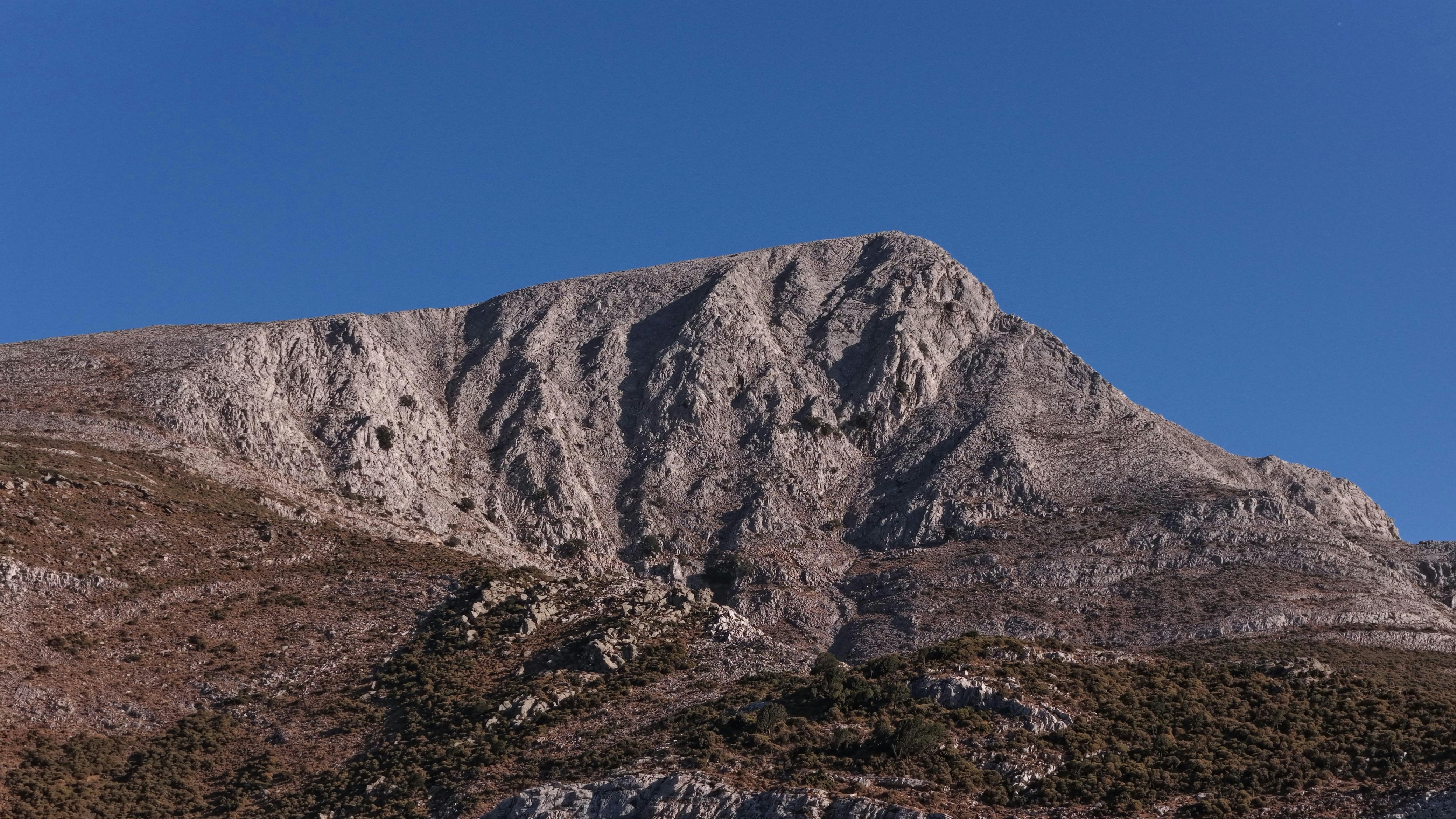 Rocky mountain peak under a clear blue sky