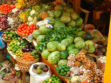 Abundant fresh fruits and vegetables at an outdoor market.