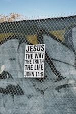 Sign with "jesus the way the truth the life" text.