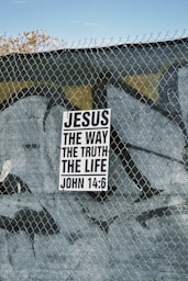 Sign with "jesus the way the truth the life" text.