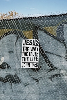 Sign with "jesus the way the truth the life" text.