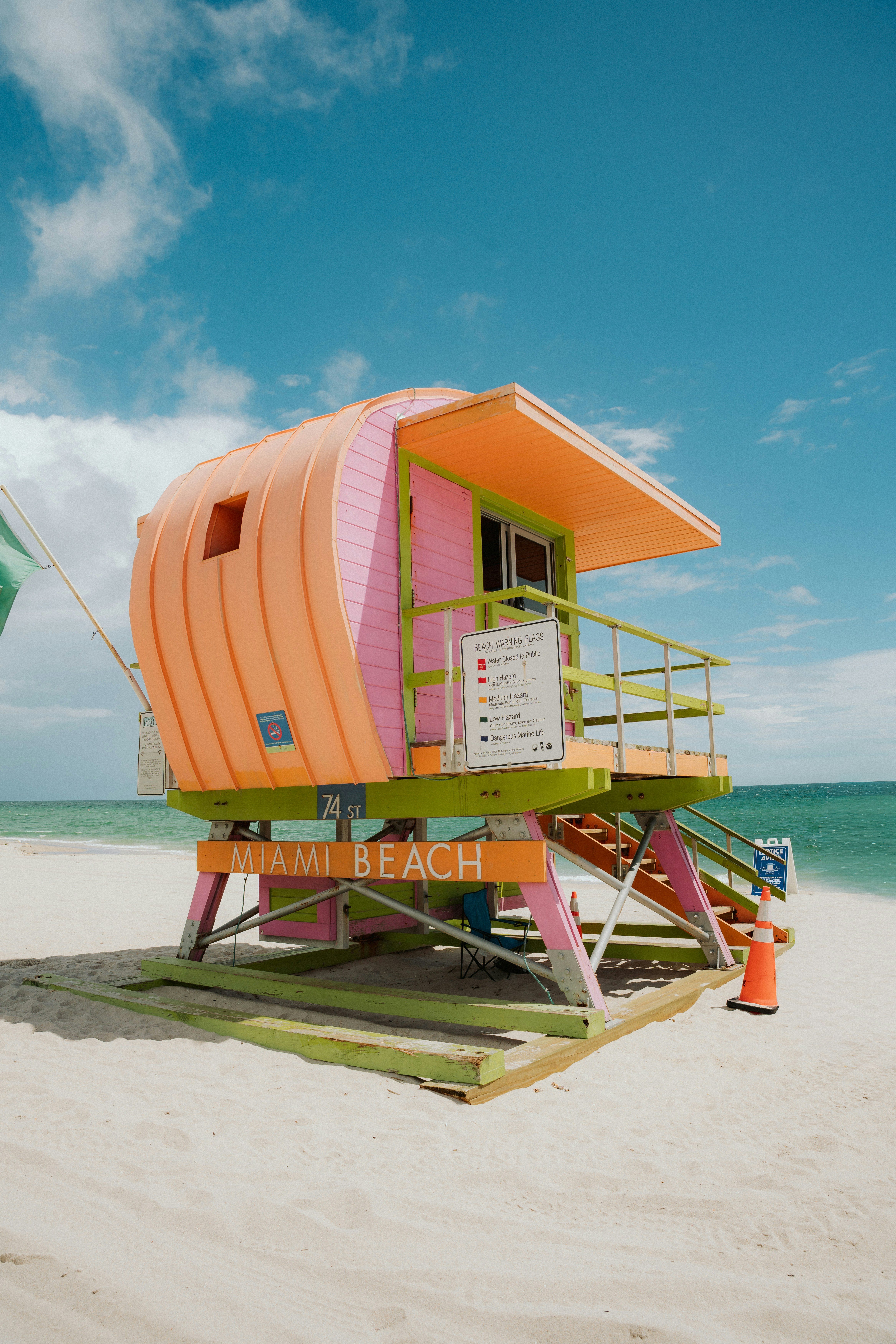 Colorful lifeguard tower on a sandy miami beach.
