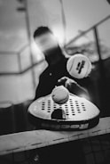 Man hitting tennis ball with paddle