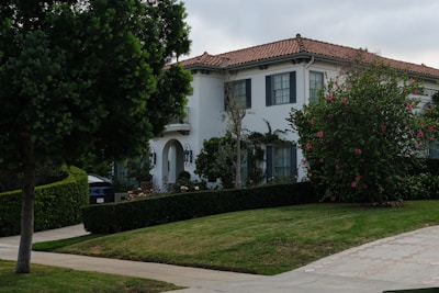 A large white house with a tiled roof.