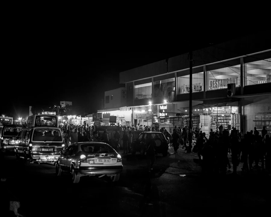 Festival crowd at night near transport queue