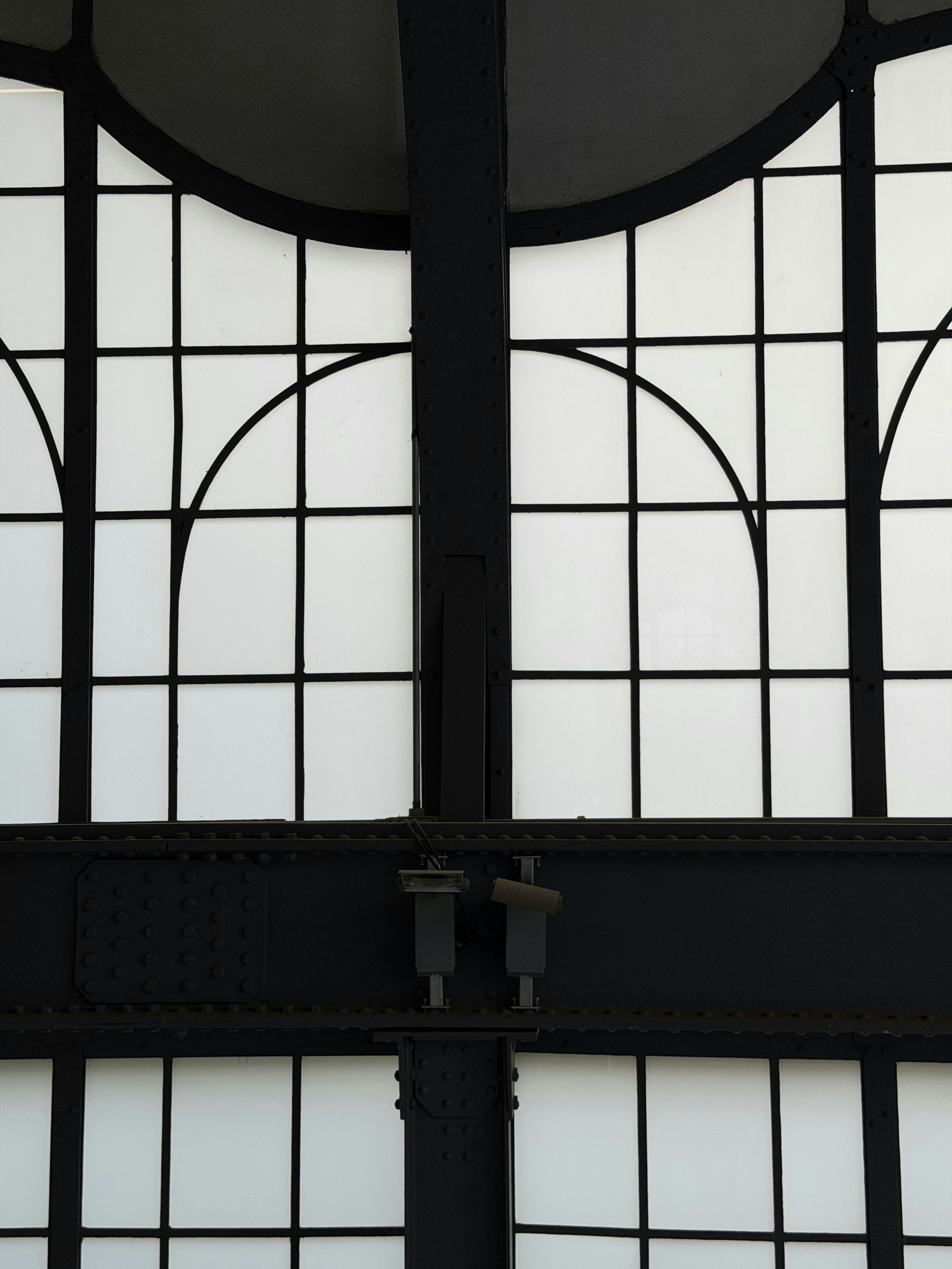 Black metal frame with white frosted glass panels.