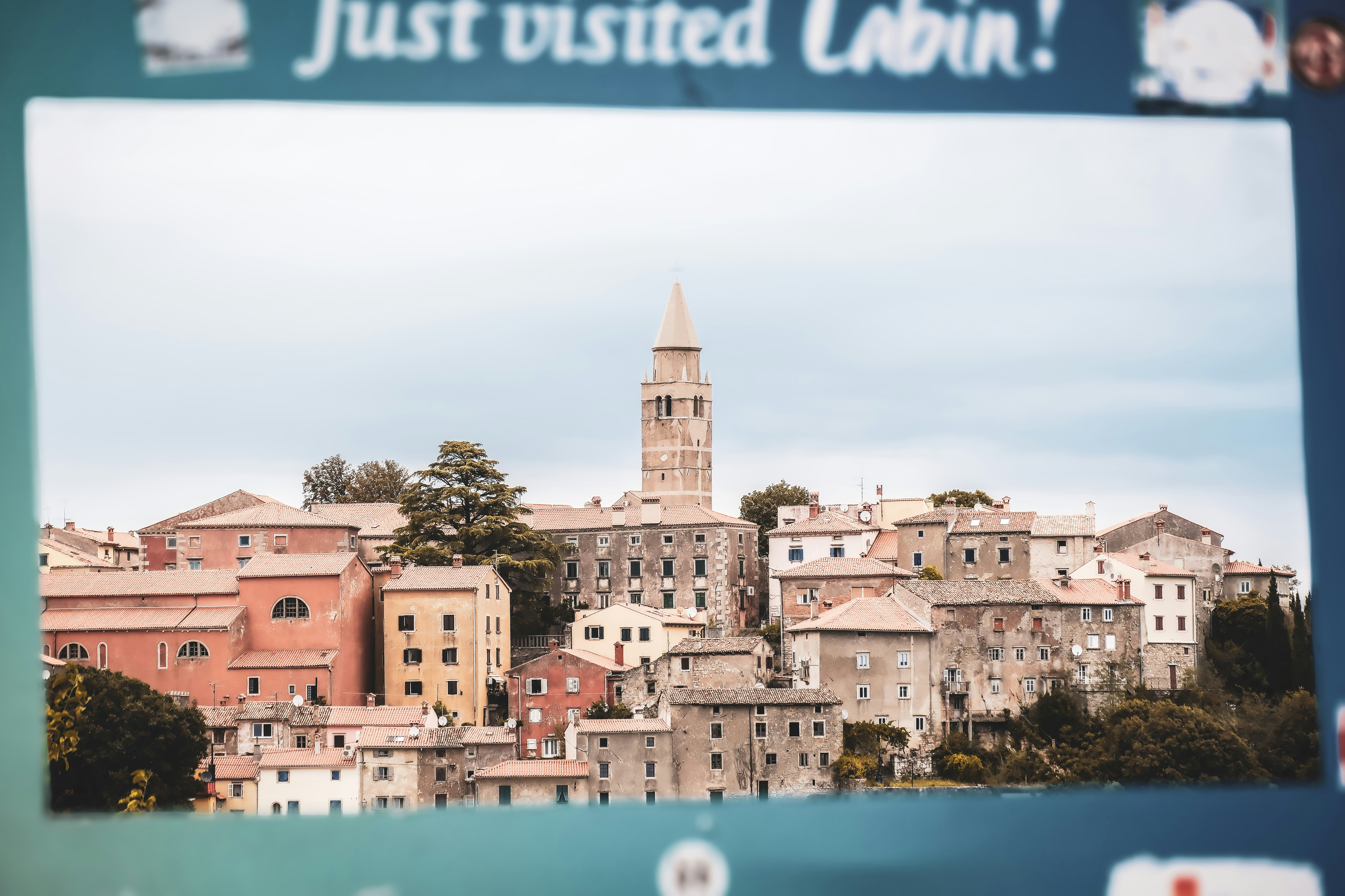 Historic european town with tall bell tower.