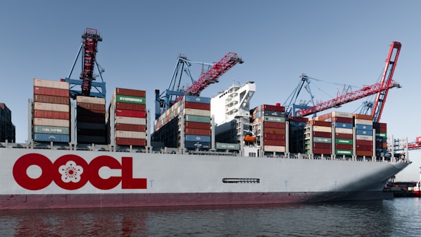 Large cargo ship loaded with containers at port.
