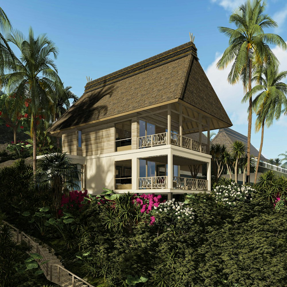 A large villa with a deep pitched roof set in dense greenery