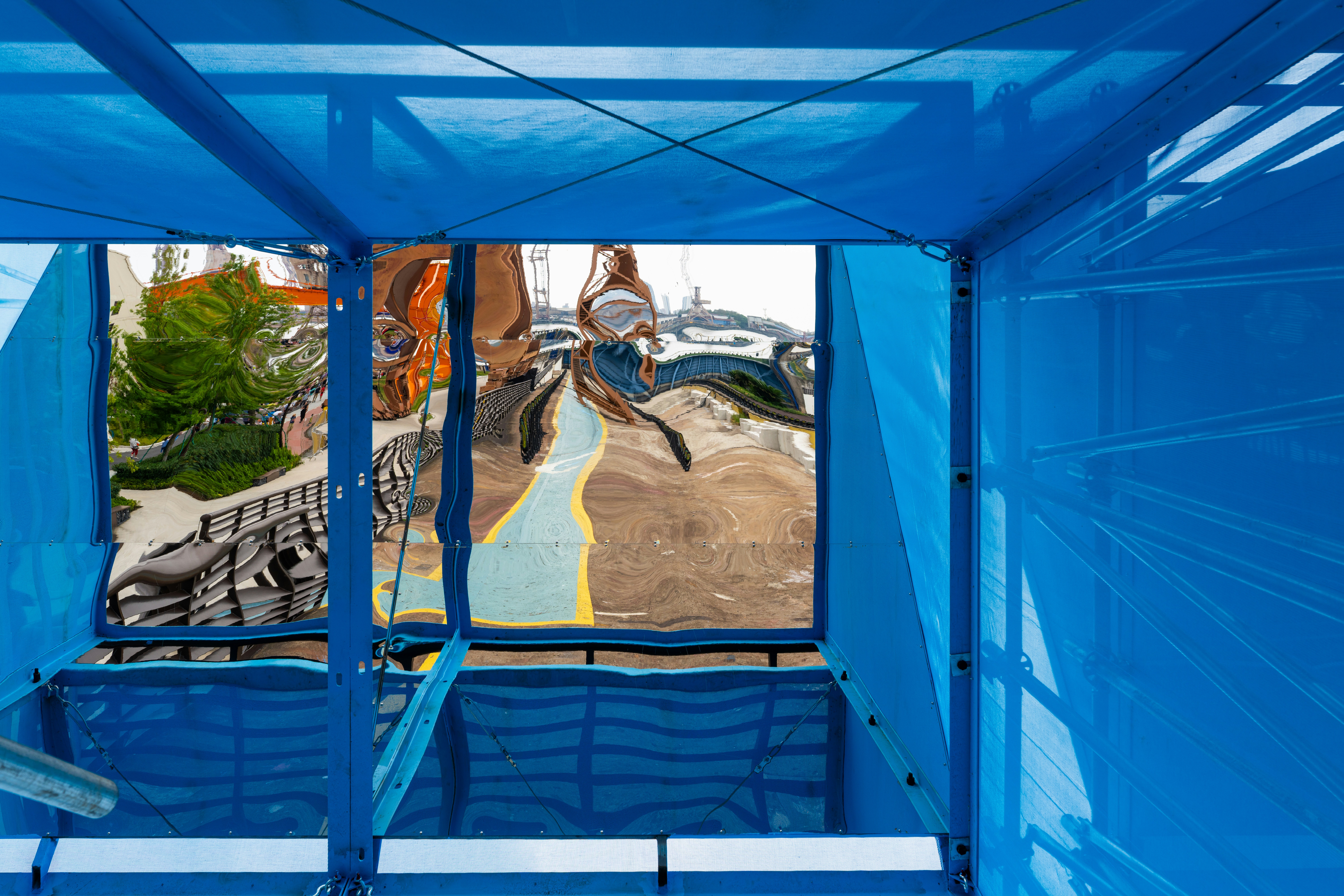 Distorted reflection in a blue structure