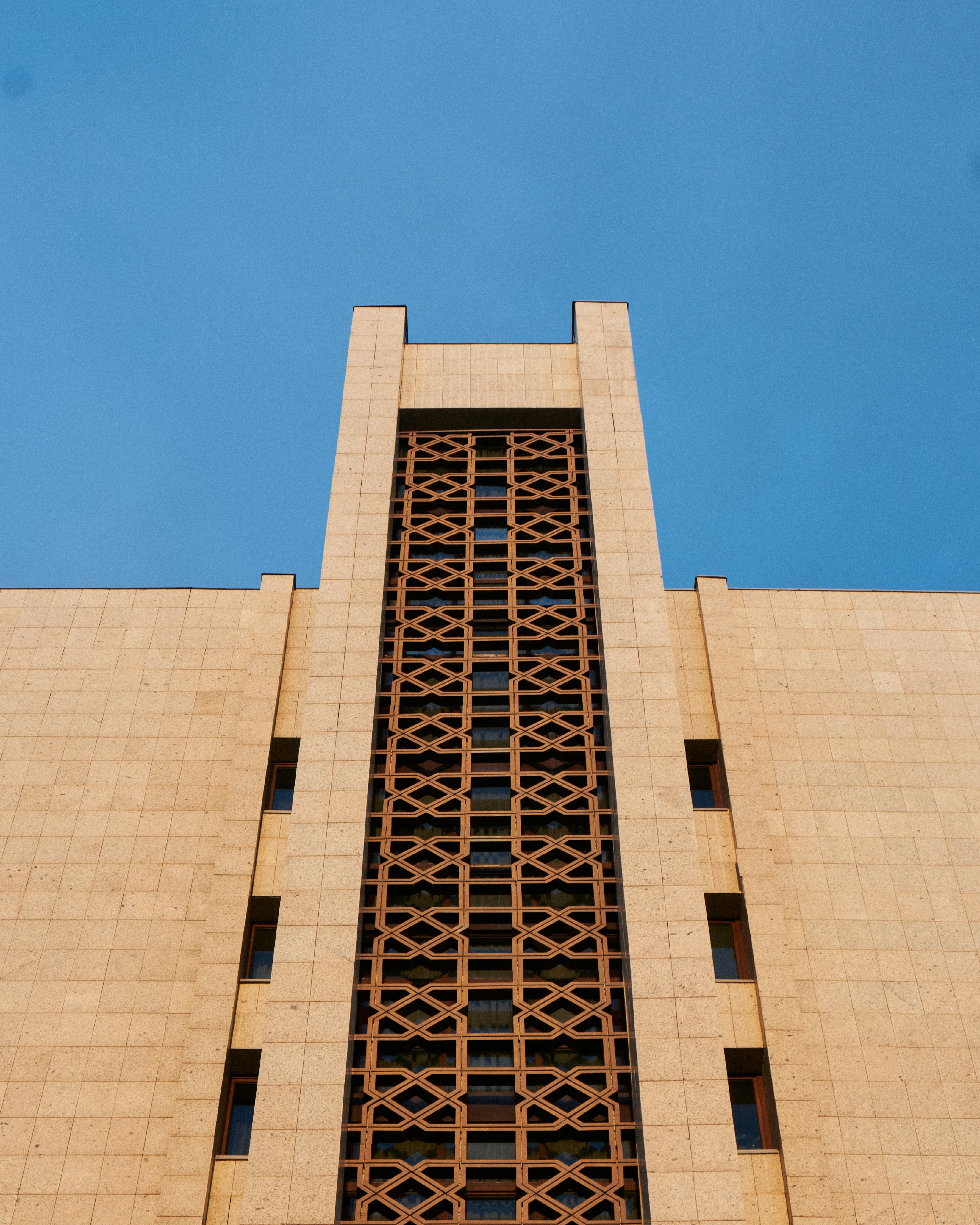 Modern building facade with geometric window patterns