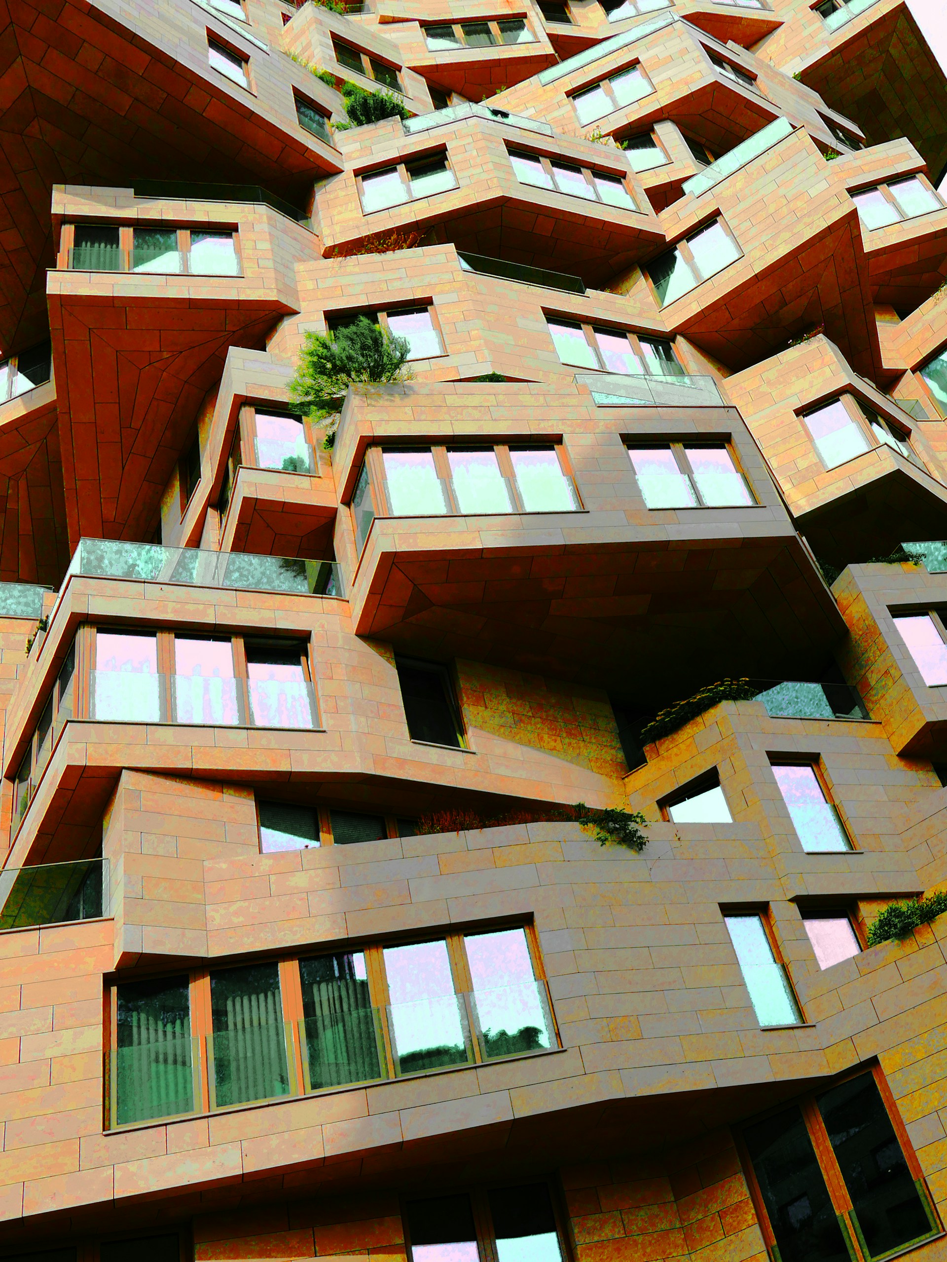 Modern building with stacked, cantilevered balconies and windows