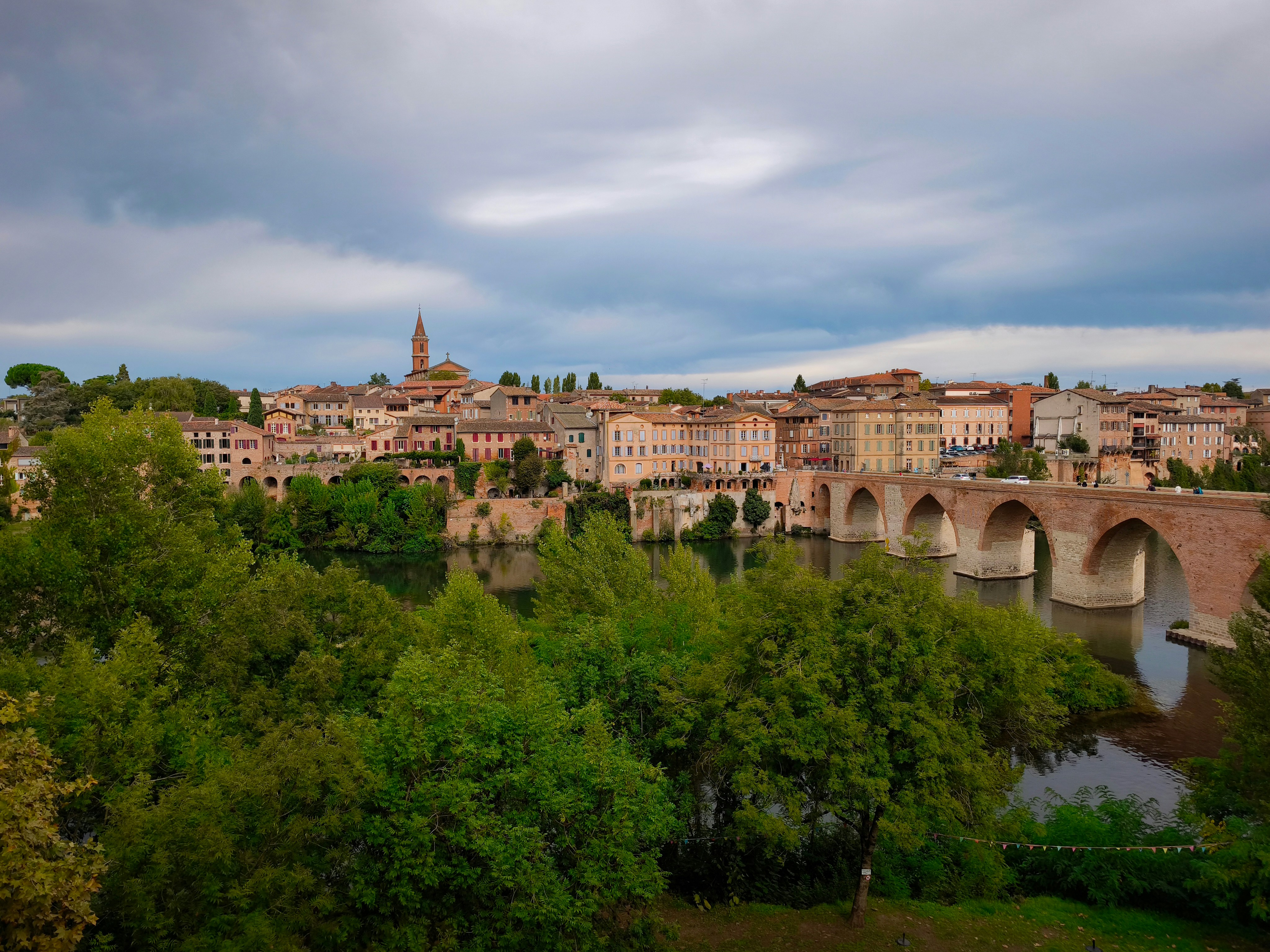 Historic european town with a bridge over a river.