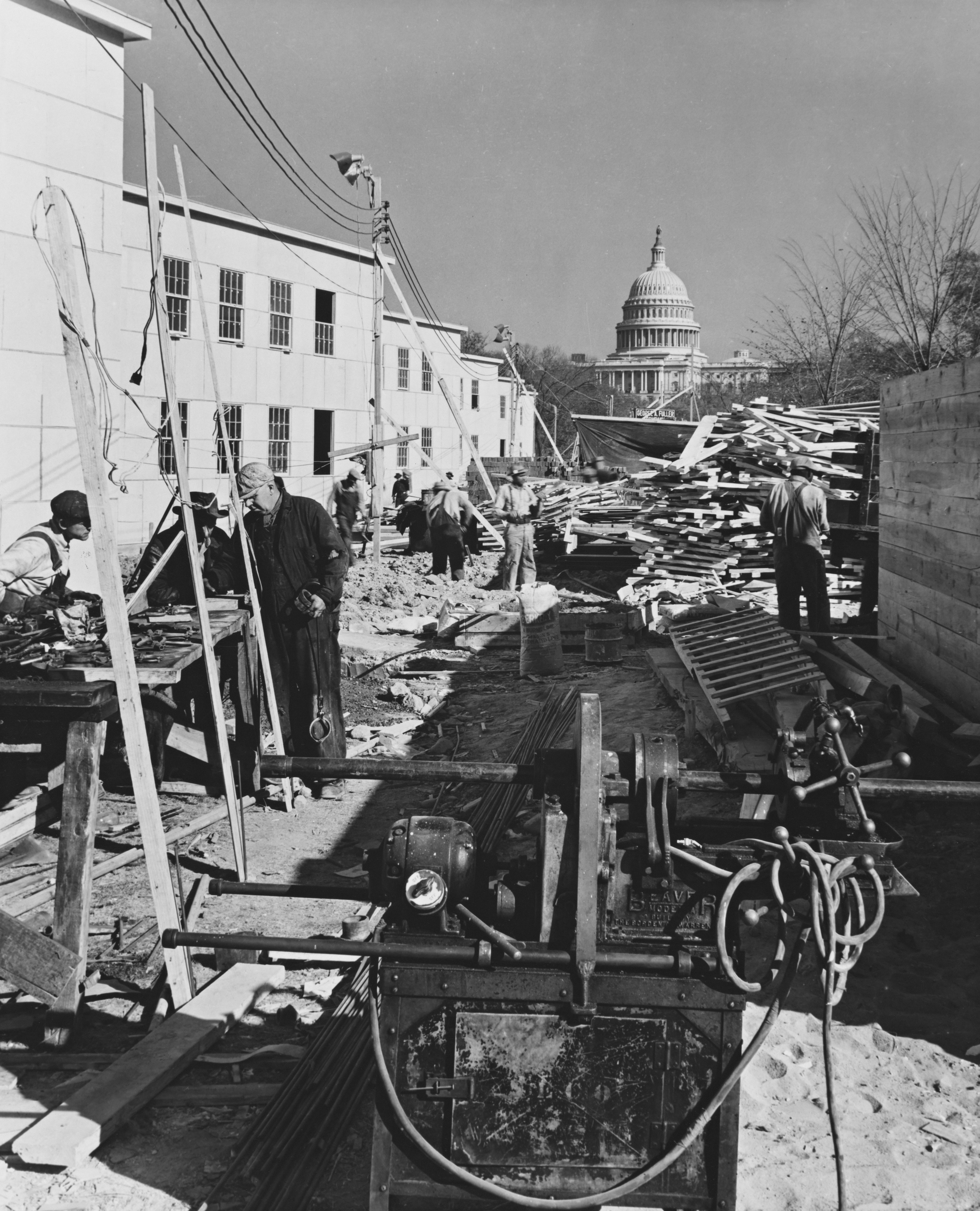 Construction workers building near the capitol building