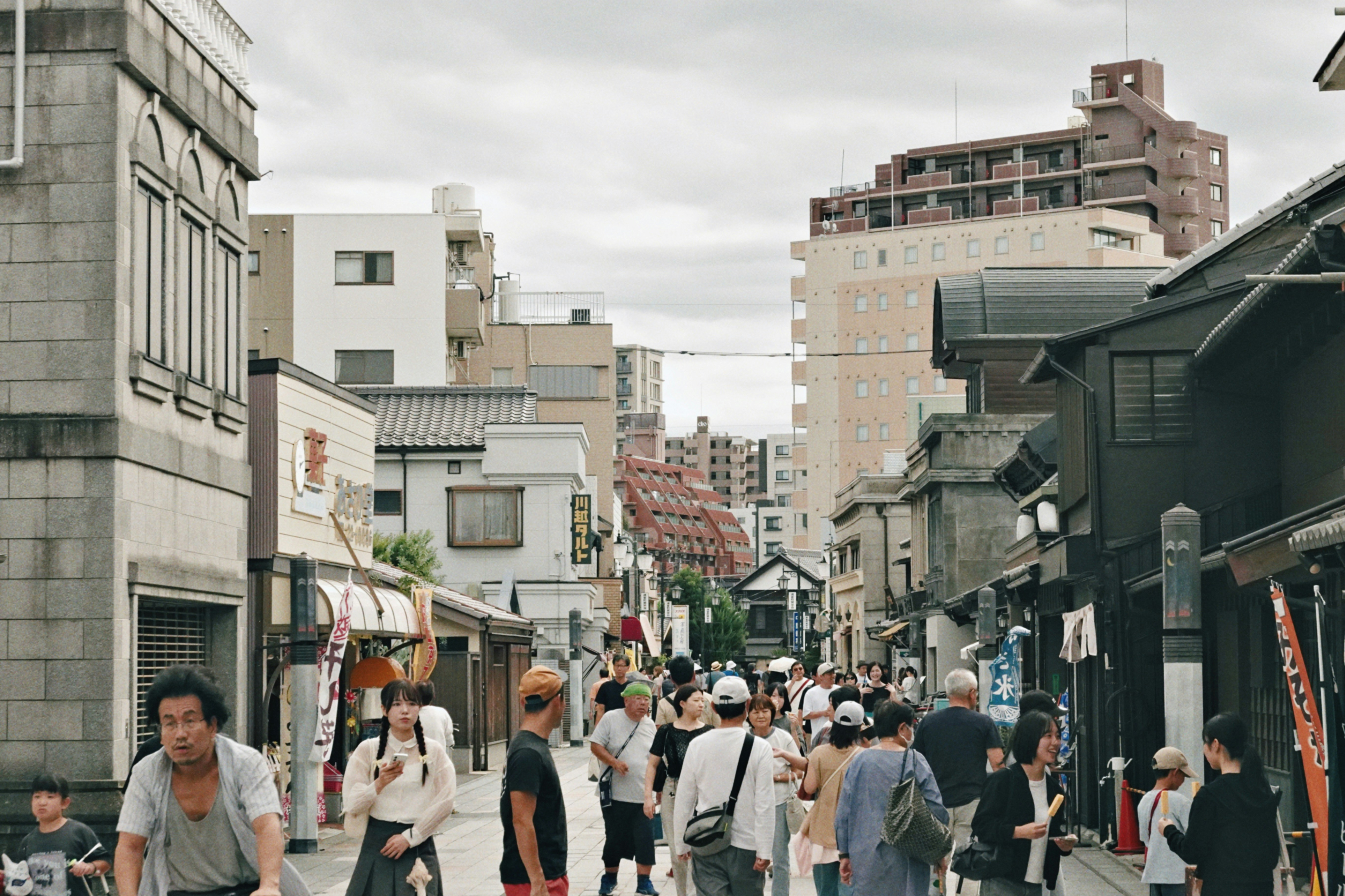 Bustling street with mix of traditional and modern architecture