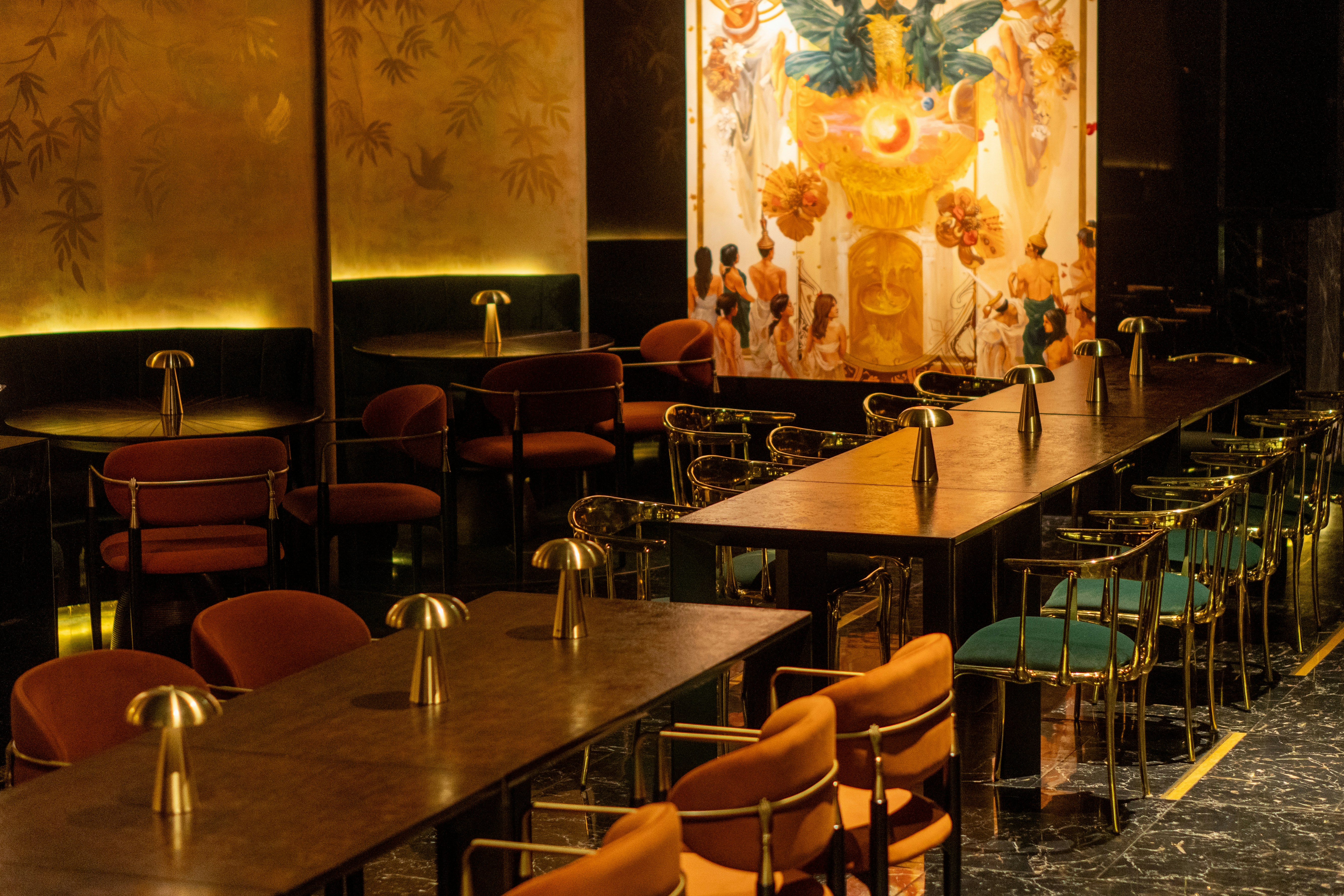 Modern bar interior with plush seating and decorative wall art