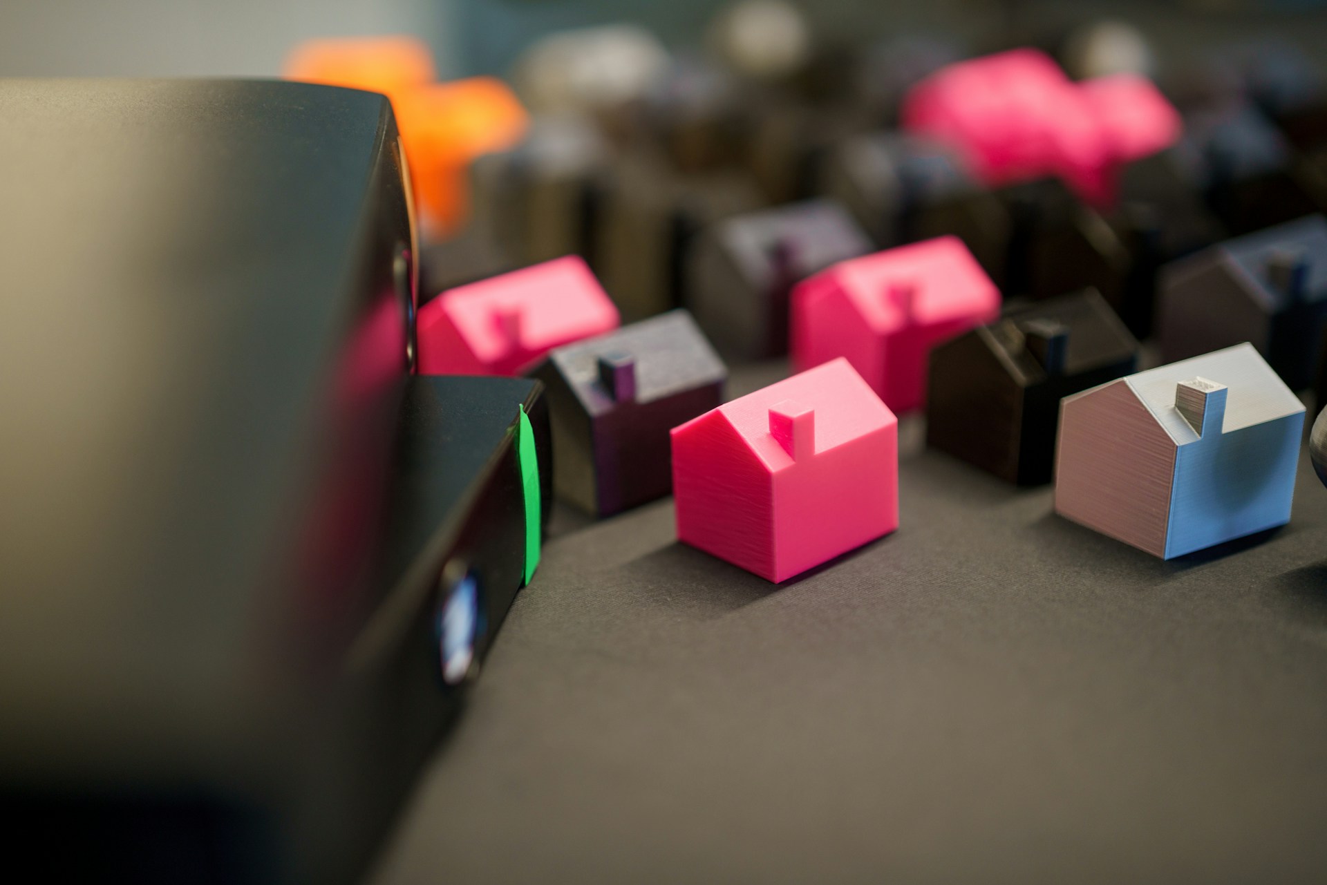 Many small colorful houses arranged in rows.