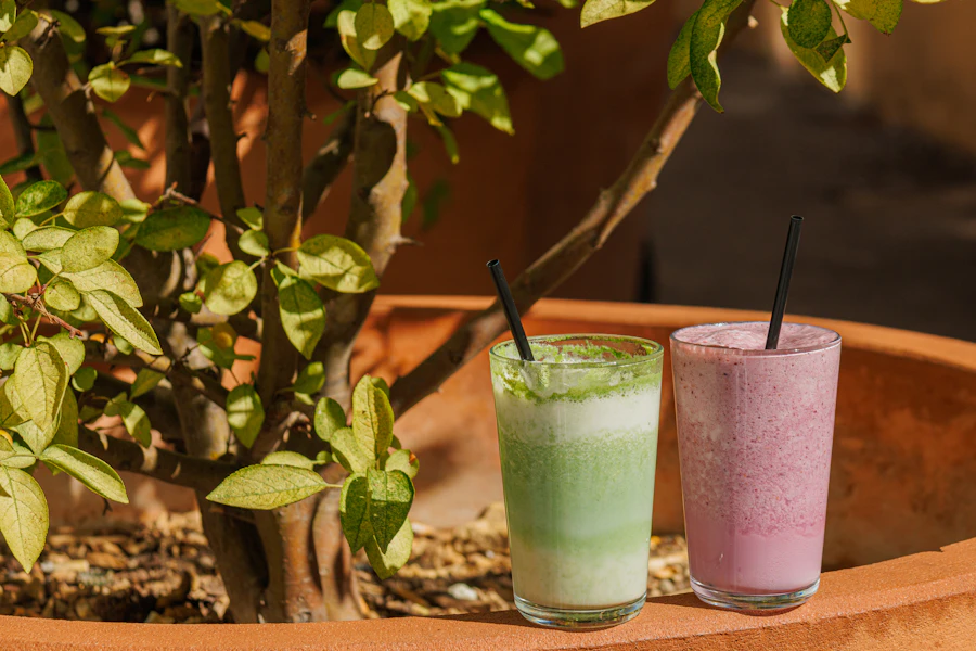 Green and pink iced drinks with straws