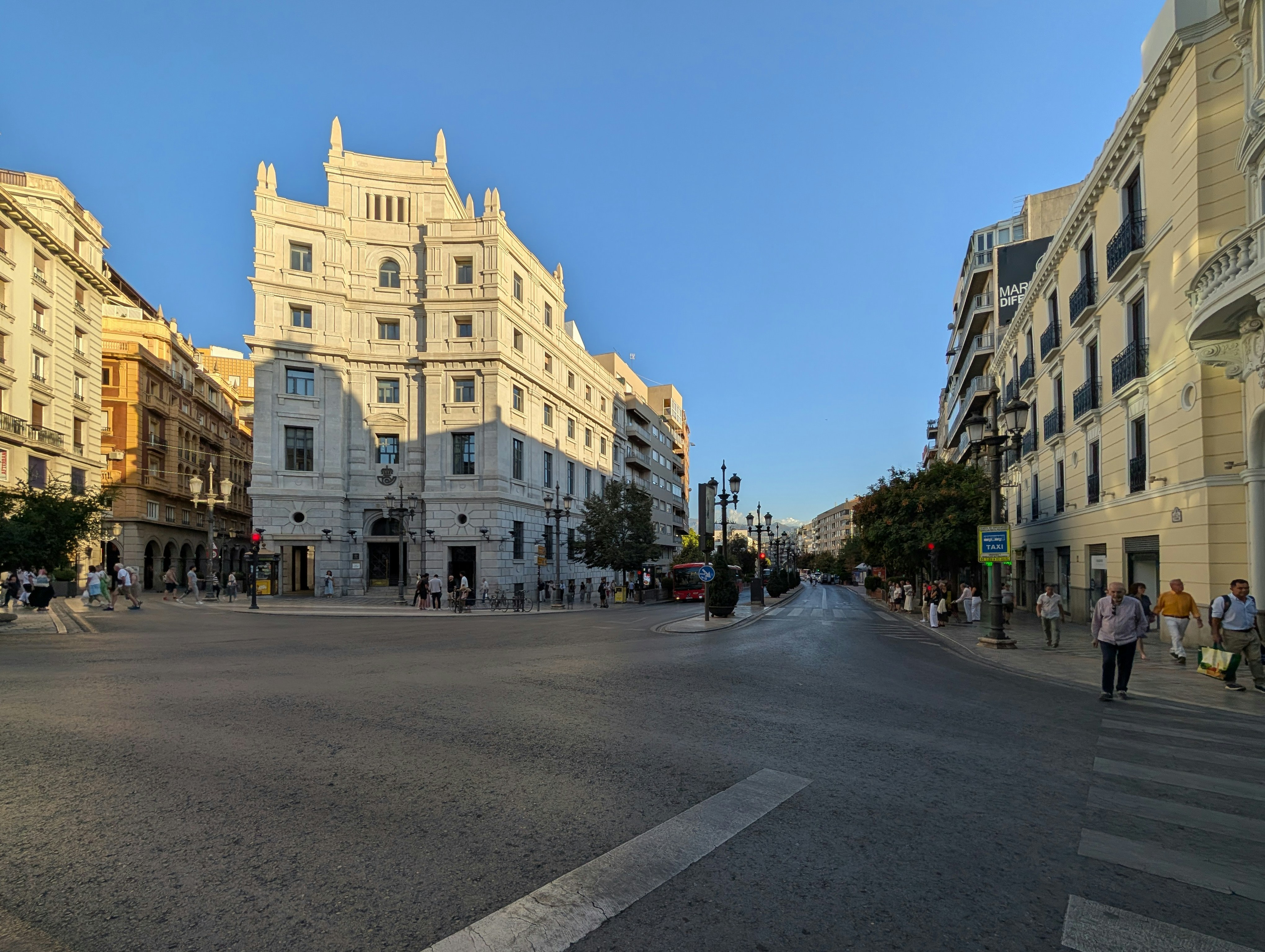 Sunny European city square with ornate buildings