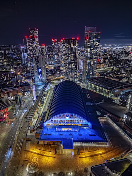 Manchester cityscape at night with illuminated buildings