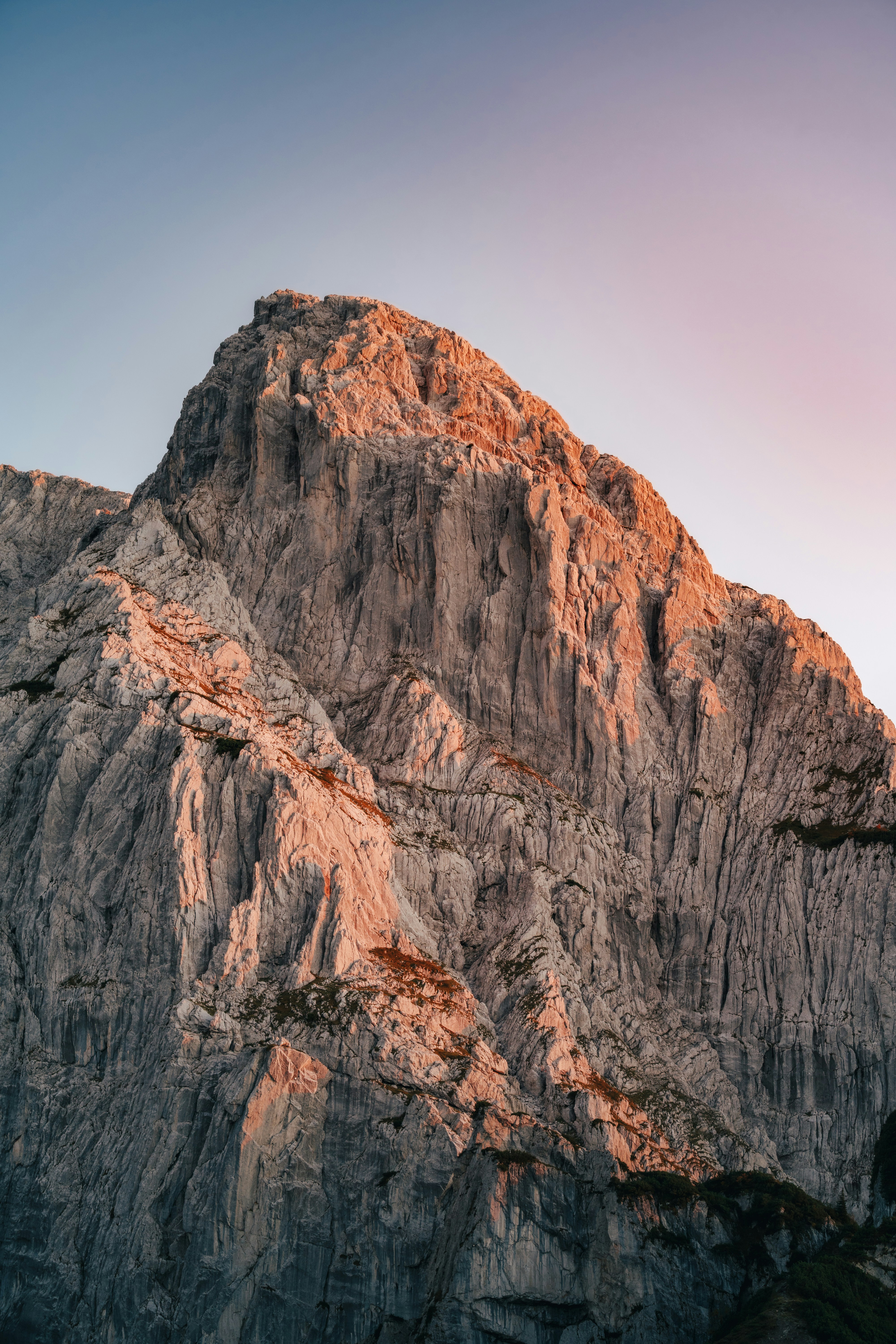 Rugged mountain peak illuminated by warm sunset light