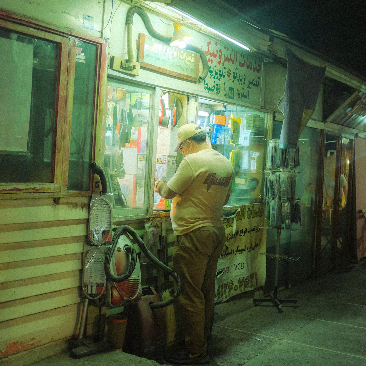 Shop owner at the service counter