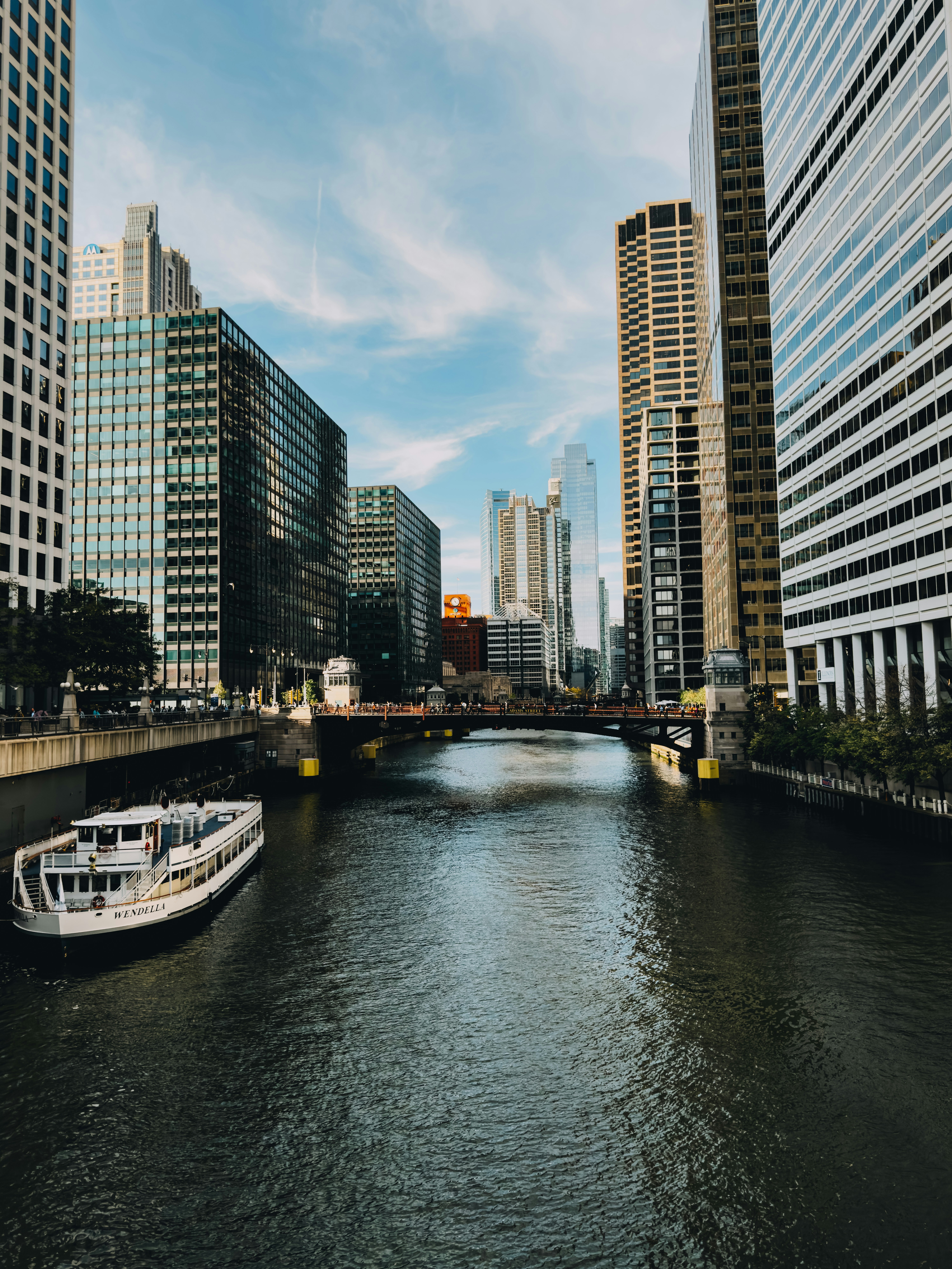 Architecture river tour Chicago at night with skyline lights reflected on the river