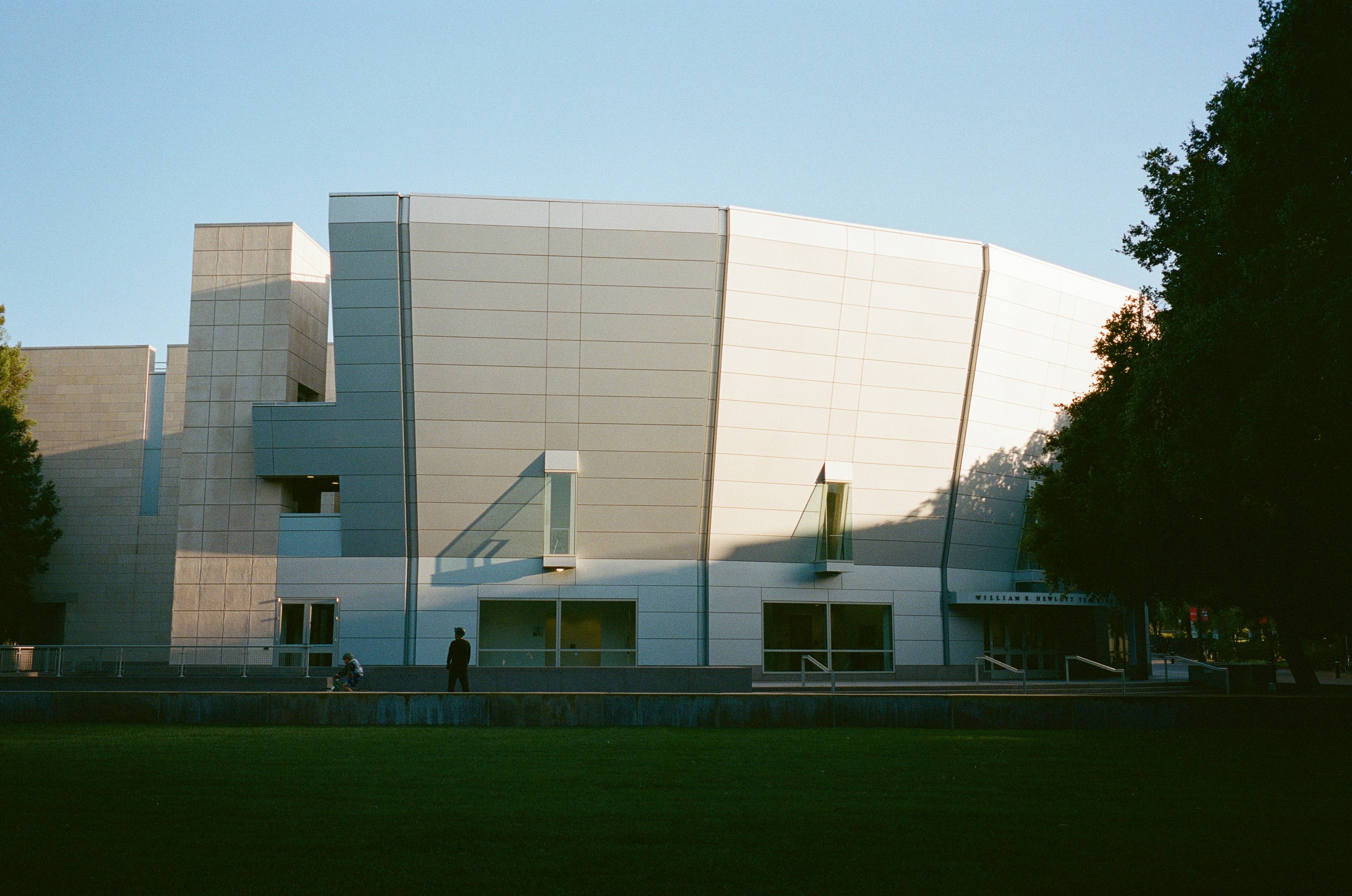 Modern building with geometric facade in sunlight