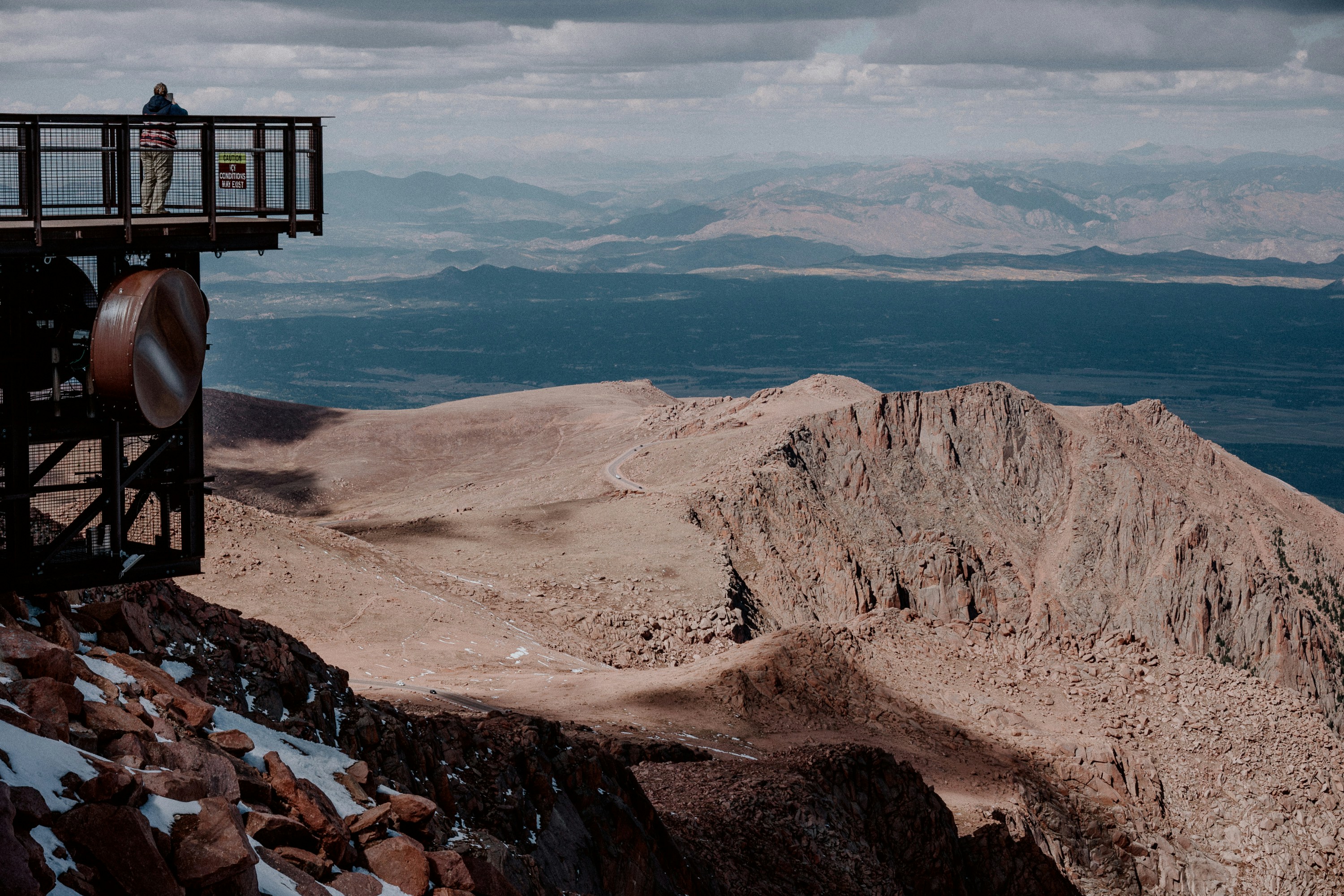 Observation deck overlooking a vast mountain range