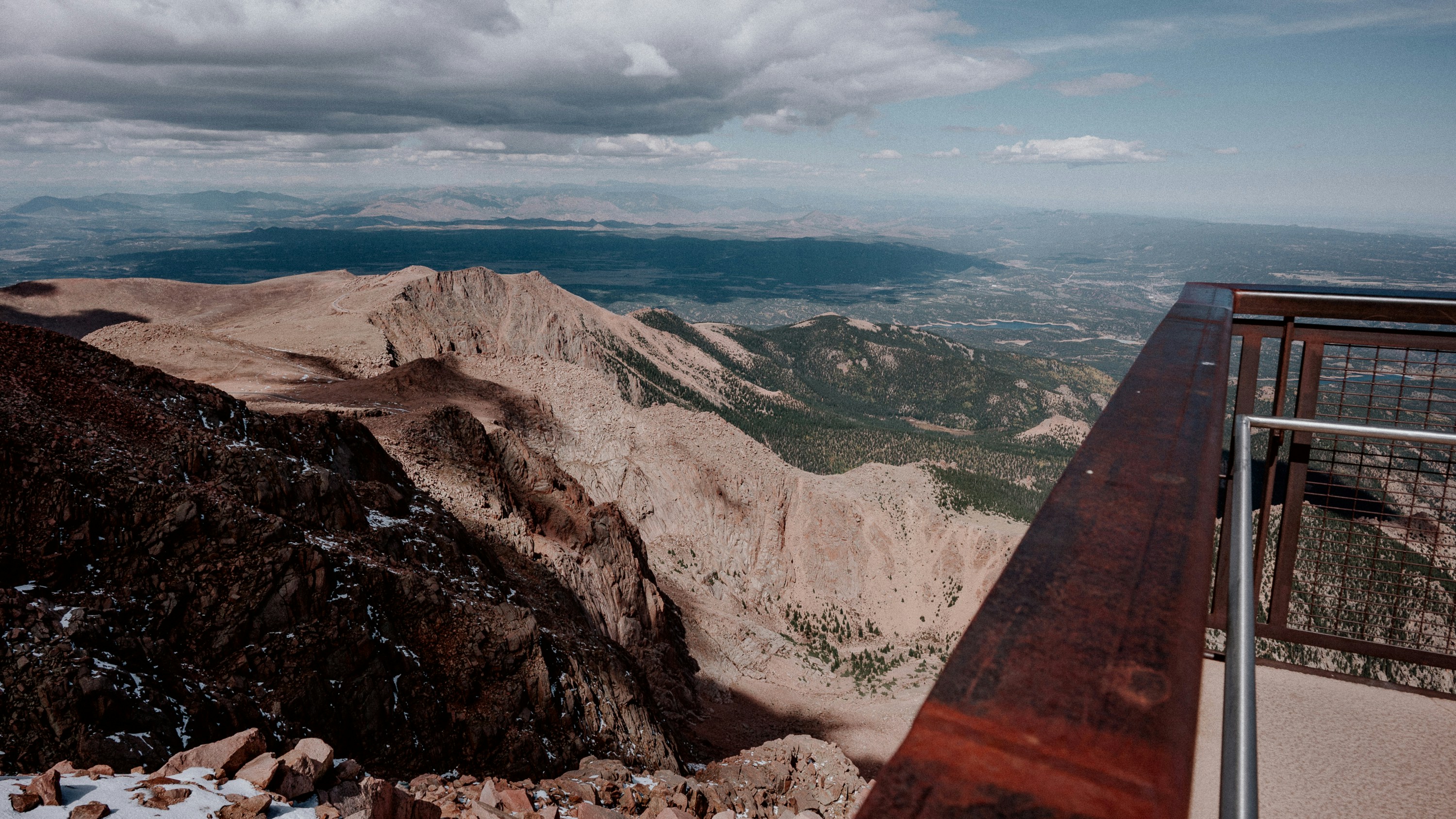 Mountain overlook with vast landscape below