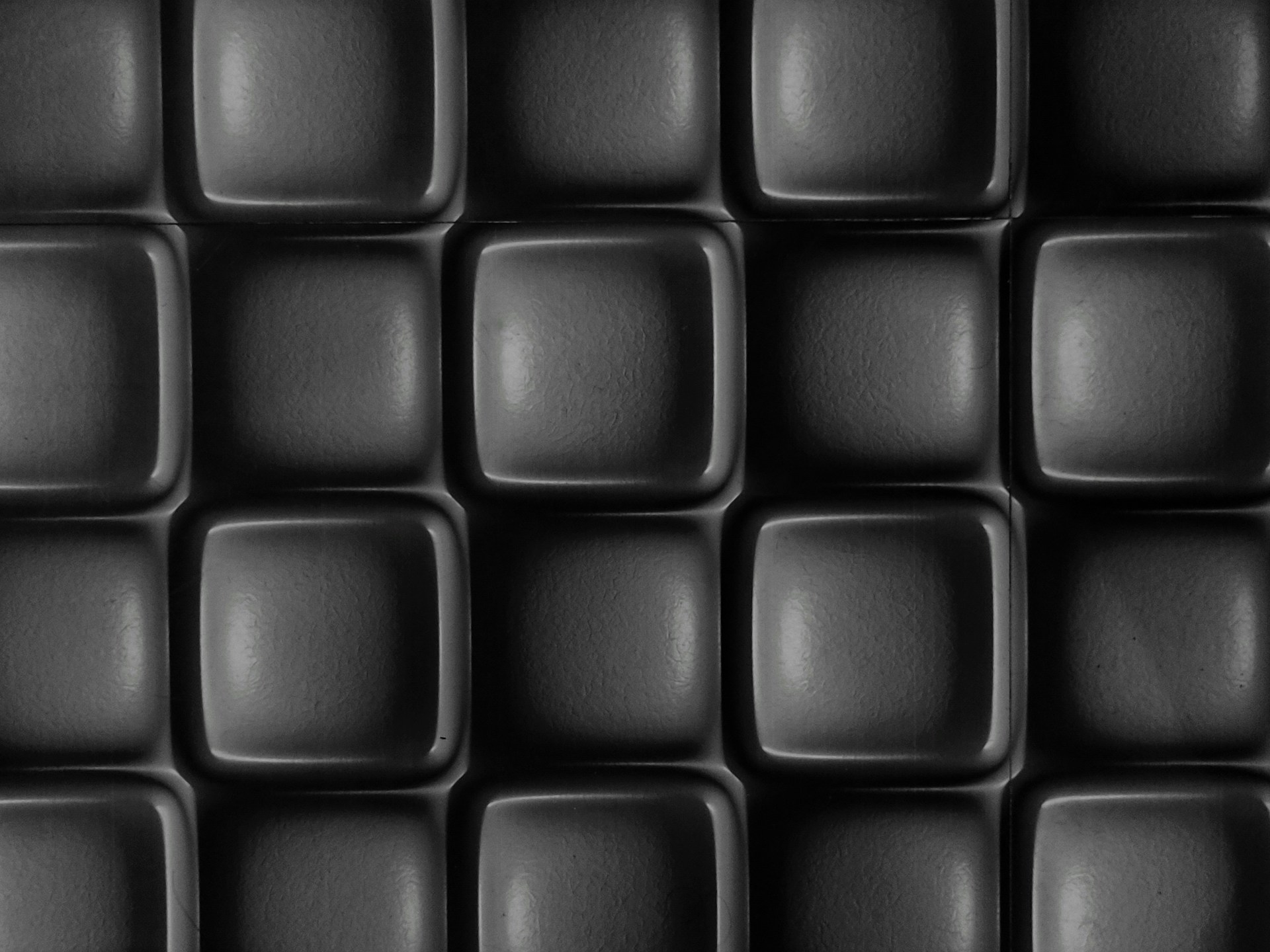 A grid of dark, rounded square shapes.